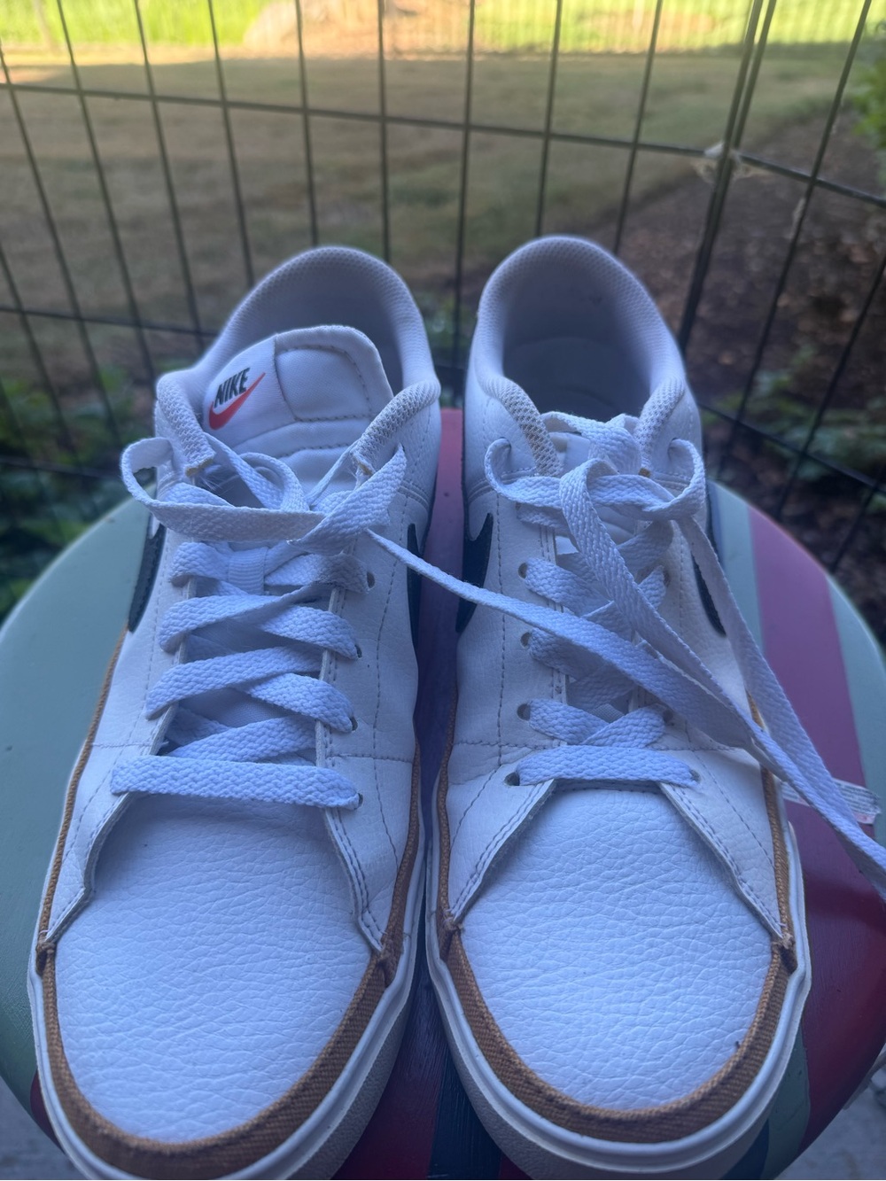 Nike Women’s White Sneakers with Brown Trim and Black Swoosh